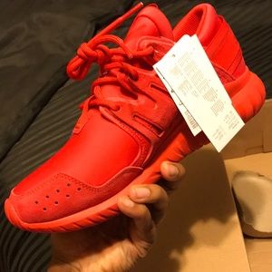 Red Adidas in men size 7.5 in women size 9 NWT